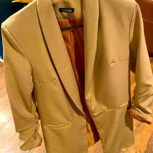 Beige blazer with ruffled sleeves